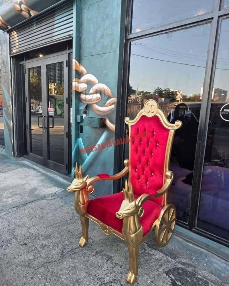 Hire Santa Frisco with a red tufted Santa throne and gold reindeer armrests ready for a photo line.